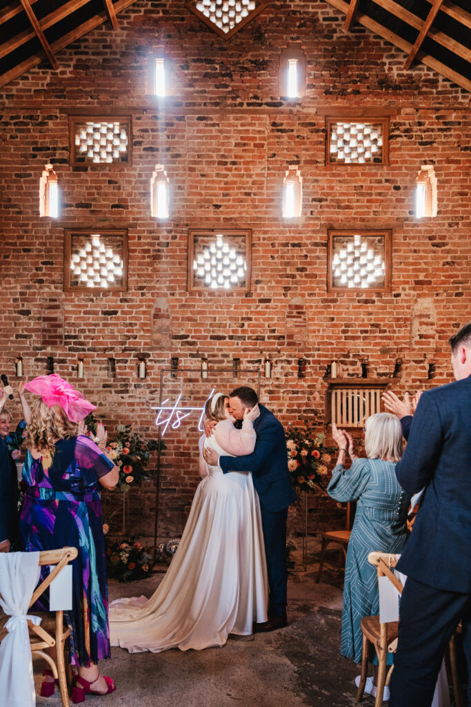 Bride and Groom kissing at Lodge Farm Weddings in York