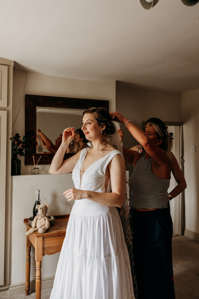 Bride getting veil put in at The Normans York