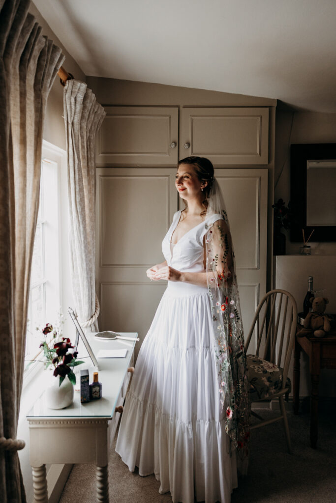 Bride staring out of window at The Normans York