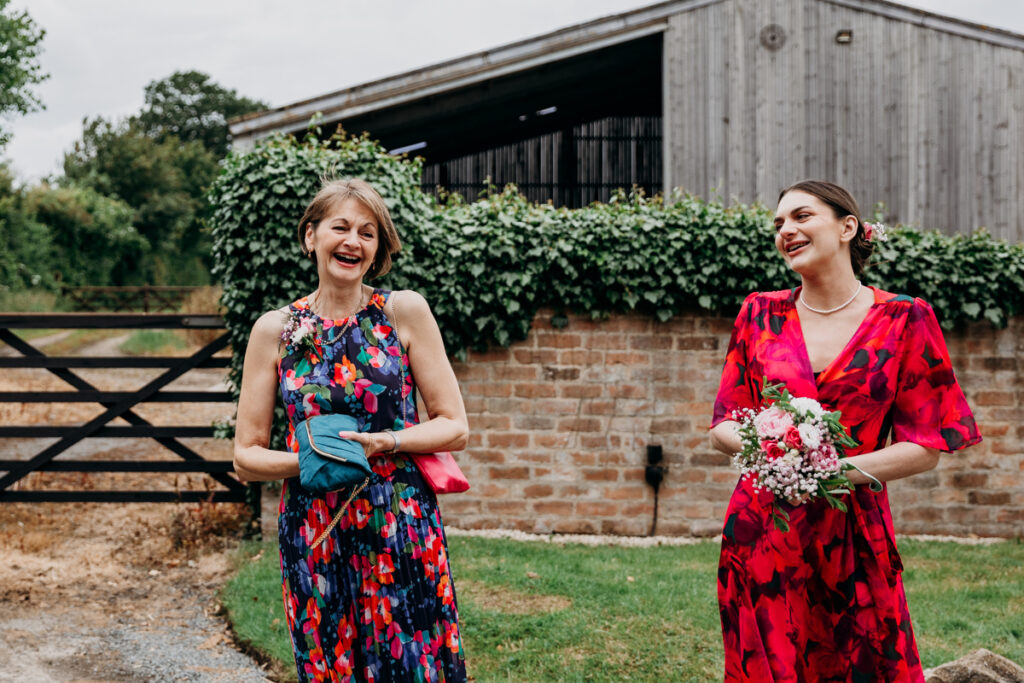 Bride's mum and bridesmaid laughing at The Normans York