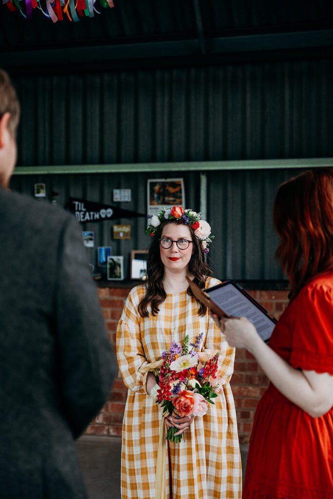 Bride saying vows at The Giraffe Shed