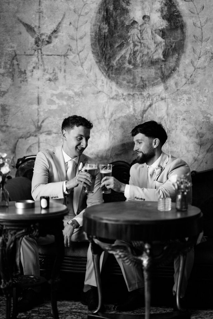 Groom and best man having a beer at Thicket Priory