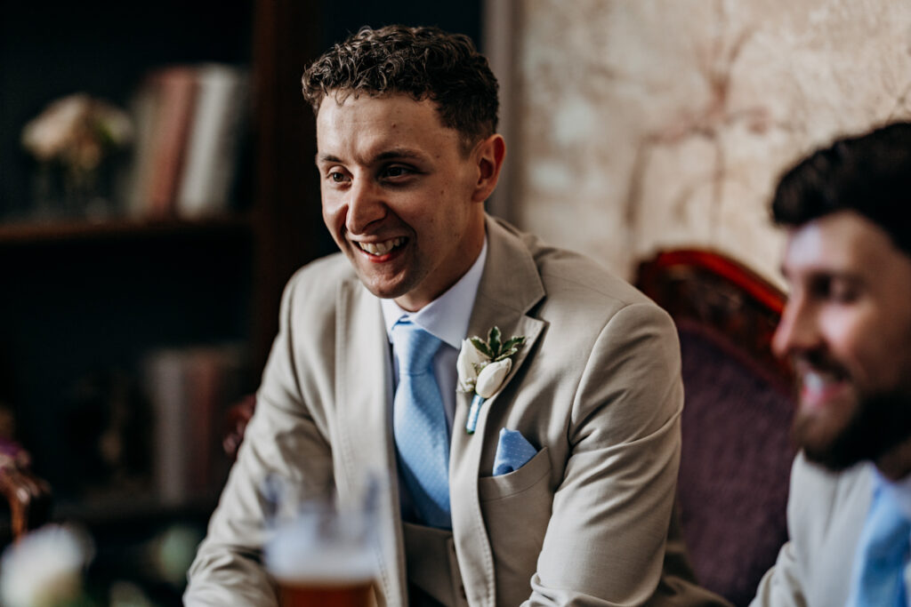 Groom smiling at Thicket Priory