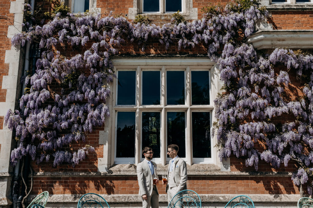 Groom and best man having a beer at Thicket Priory