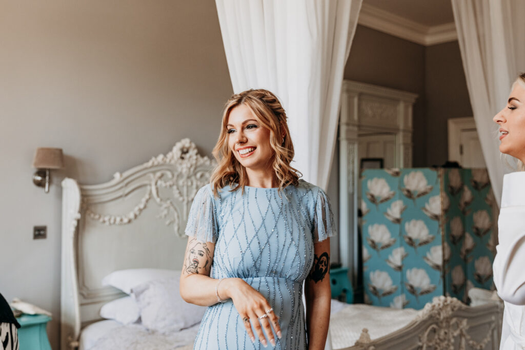 Bridesmaid smiling at Thicket Priory
