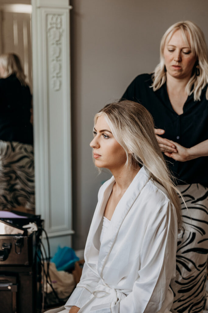 Bride having hair done at Thicket Priory
