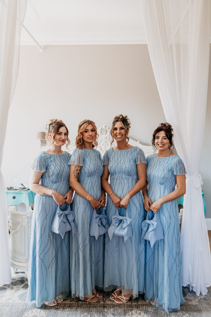 Bridesmaids with bow bags at Thicket Priory