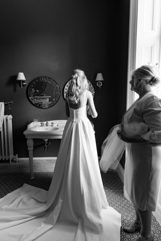 Bride getting dressed at Thicket Priory
