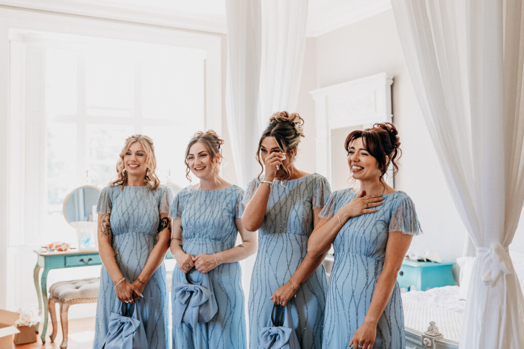 Bride dress reveal to bridesmaids at Thicket Priory