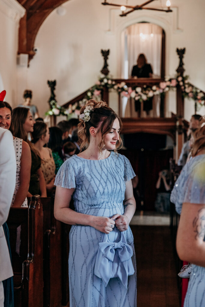 Bridesmaids walking down aisle at Thicket Priory
