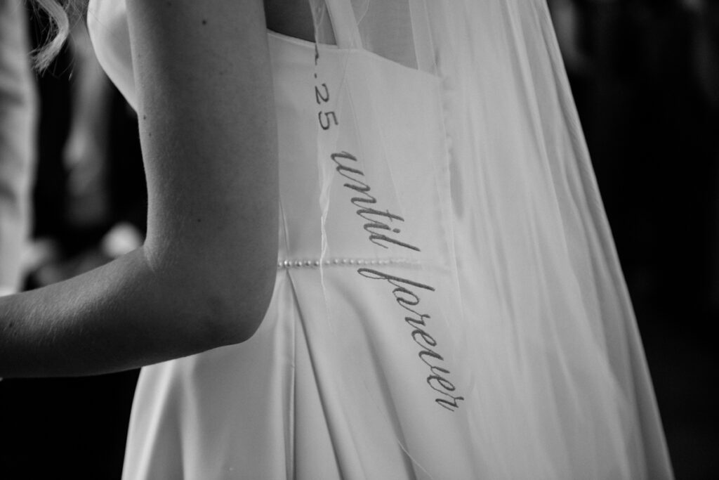 Bride's stitching in veil at Thicket Priory