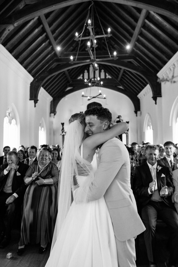 Bride and groom hugging at Thicket Priory