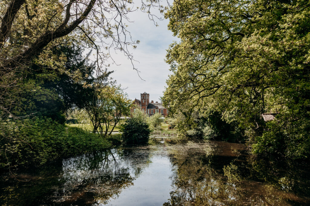 Thicket Priory exterior from lake