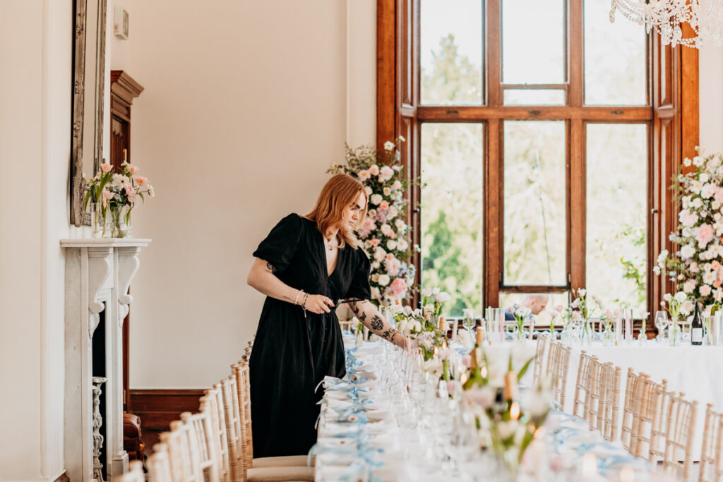 Lily lighting candles at Thicket Priory