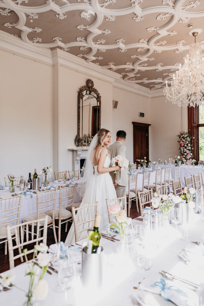 Bride and Groom viewing dining room at Thicket Priory
