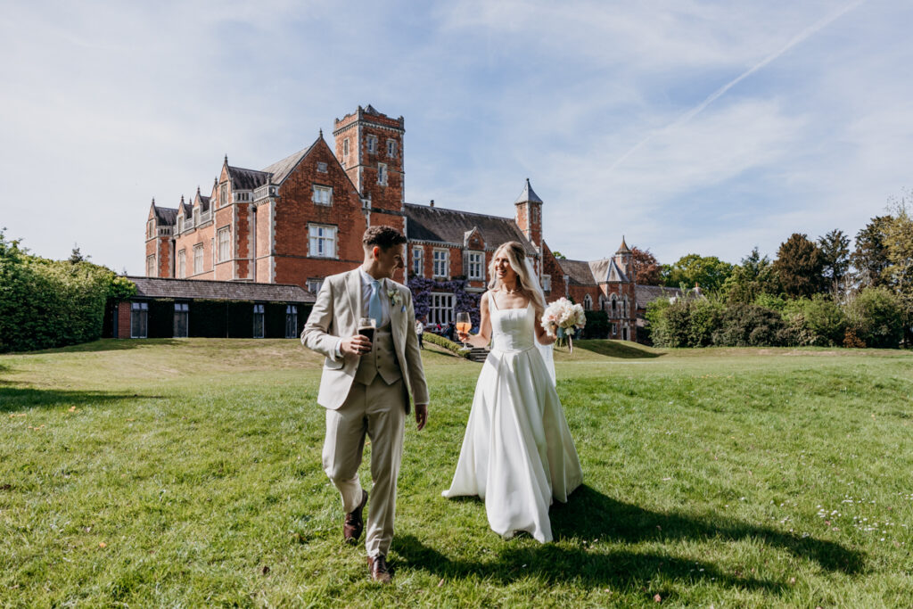 Bride and groom with Thicket Priory in background