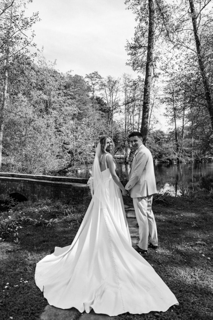 Bride and Groom by Lake at Thicket Priory