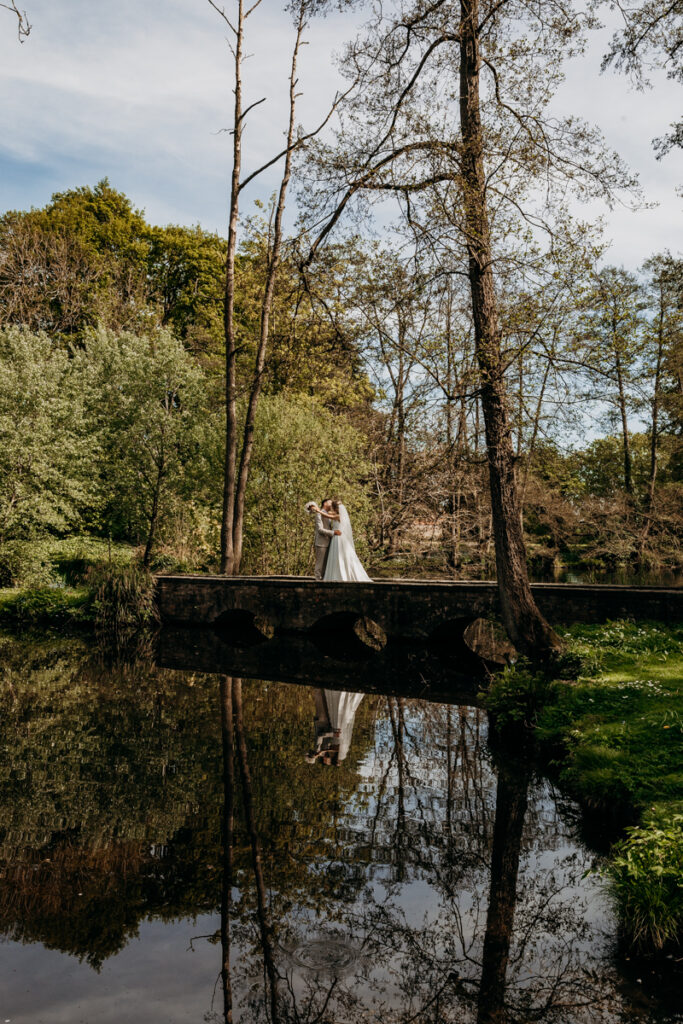 Bride and Groom by Lake at Thicket Priory