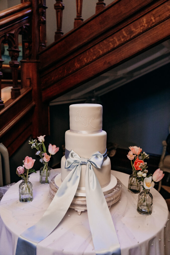 Wedding cake with huge bow at Thicket Priory