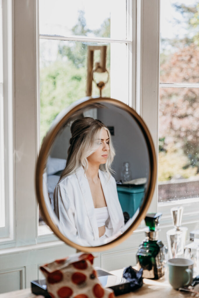 Bride in mirror at Thicket Priory