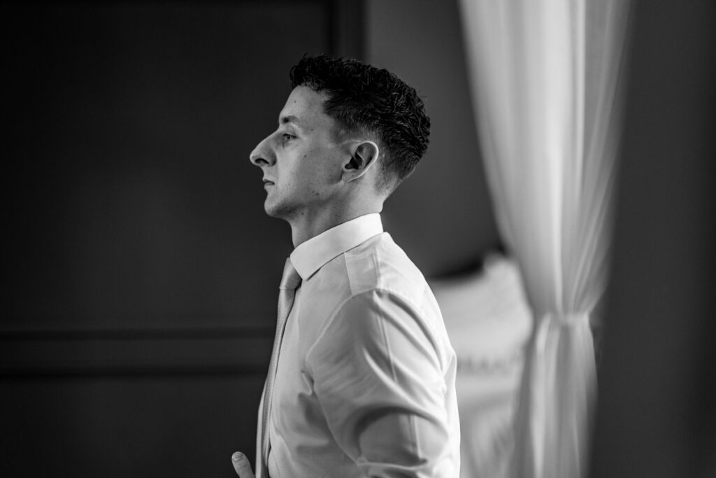 Groom getting dressed at Thicket Priory