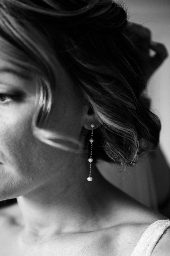 Close up of bride's earrings at Middleton Lodge