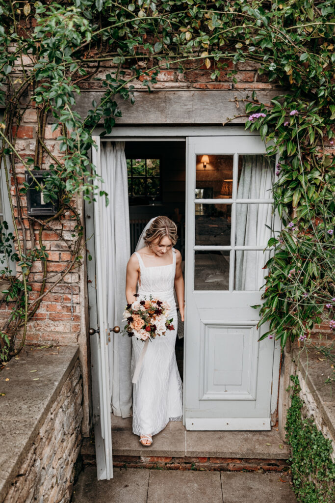 Bride stepping outside at Middleton Lodge