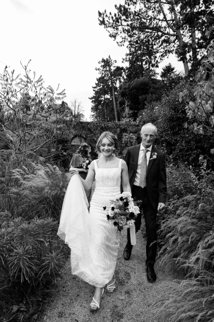 Bride walking to wedding ceremony at Middleton Lodge