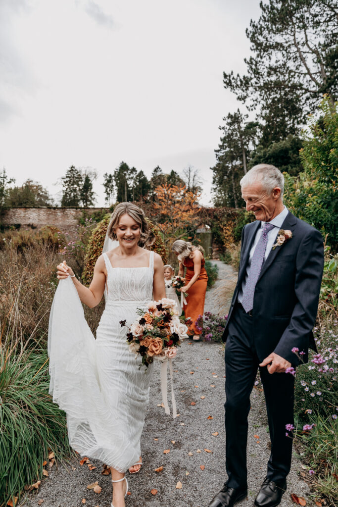 Bride walking to wedding ceremony at Middleton Lodge