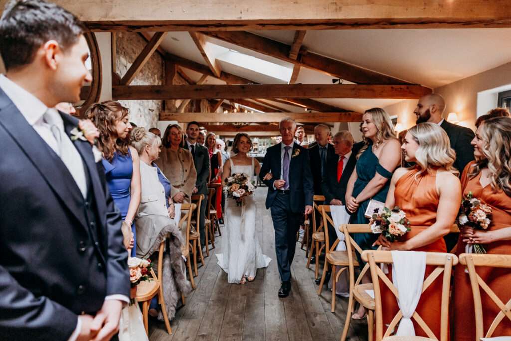 Bride walking down aisle at Middleton Lodge