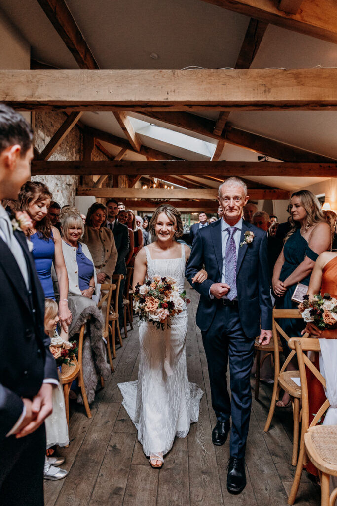 Bride walking down aisle at Middleton Lodge