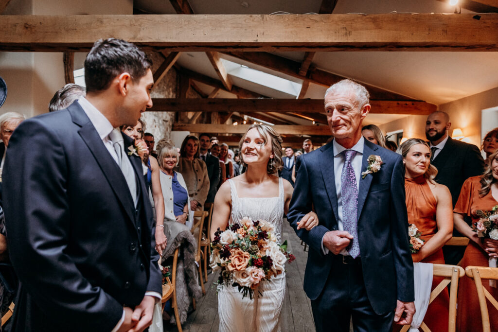 Bride walking down aisle at Middleton Lodge