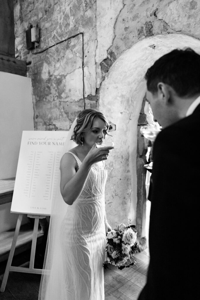 Bride drinking champagne at Middleton Lodge