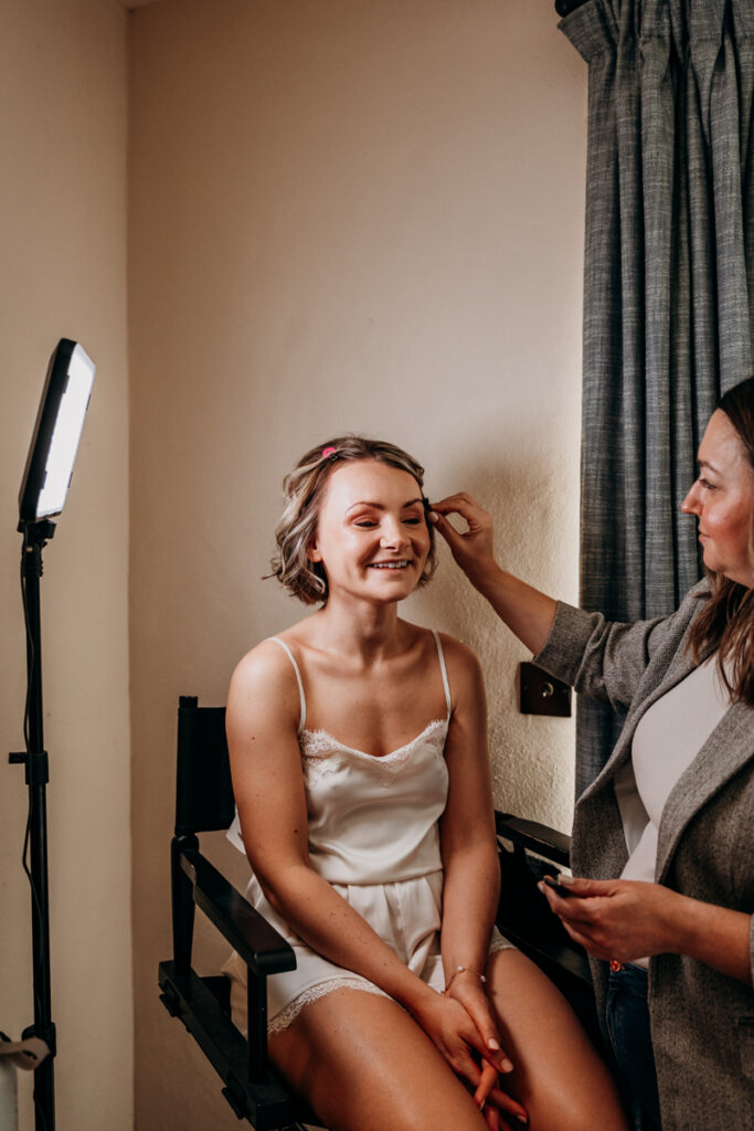 Bride having make up done at Middleton Lodge