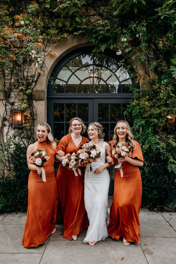 Bridesmaids laughing at Middleton Lodge
