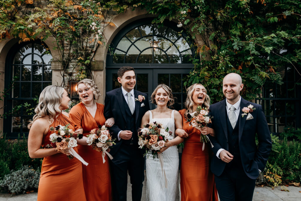 Bridal party laughing at Middleton Lodge