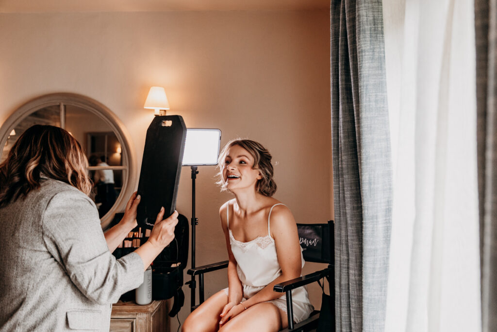 Bride in make up chair at Middleton Lodge