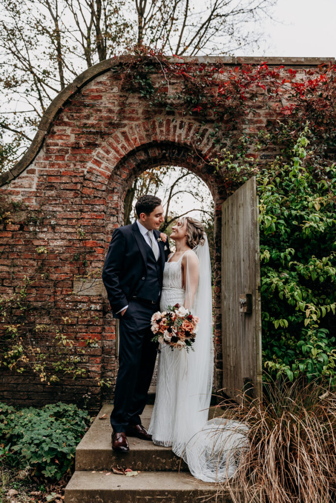 Bride and groom in walled garden at Middleton Lodge