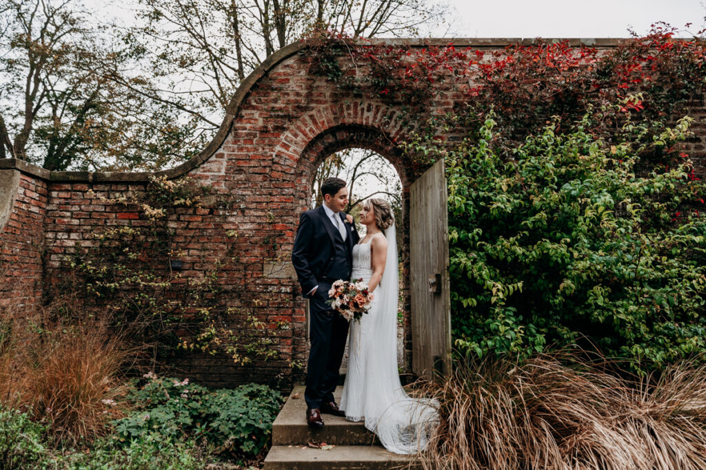 Bride and groom in walled garden at Middleton Lodge