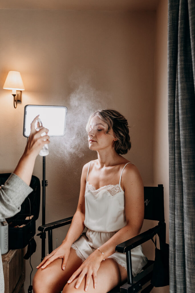 Bride in make up chair at Middleton Lodge