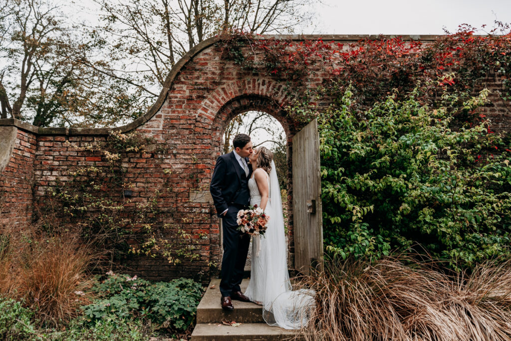 Bride and groom in walled garden at Middleton Lodge