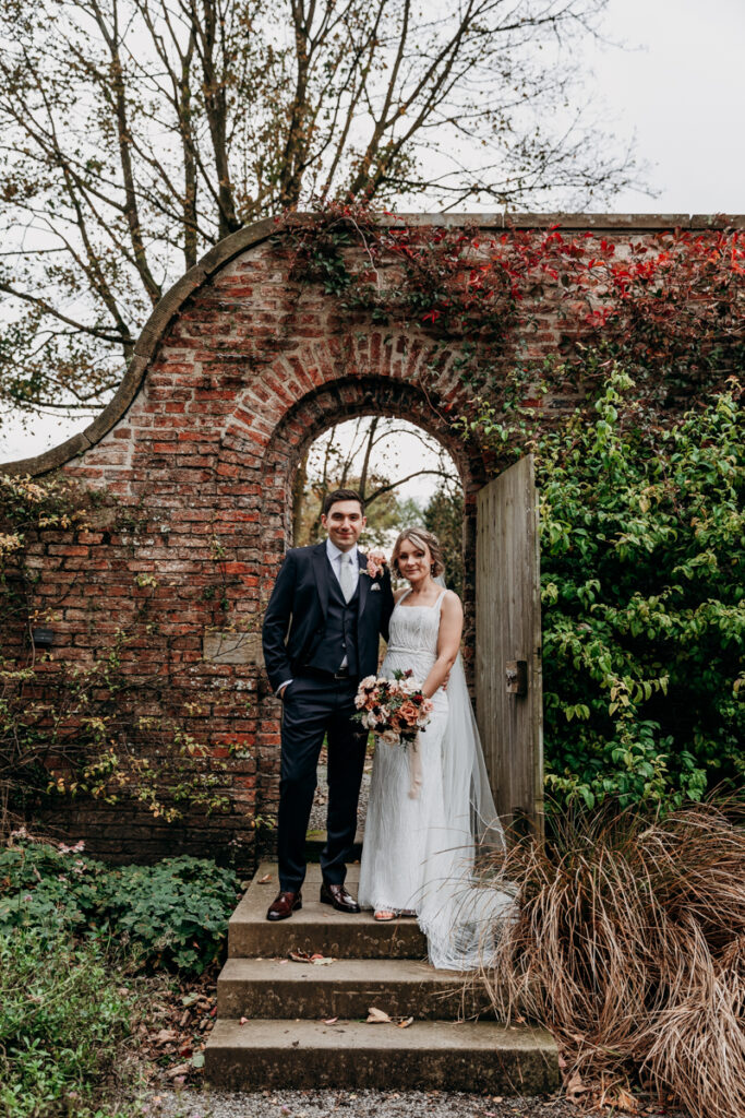 Bride and groom in walled garden at Middleton Lodge