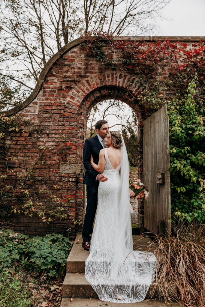 Bride and groom in walled garden at Middleton Lodge