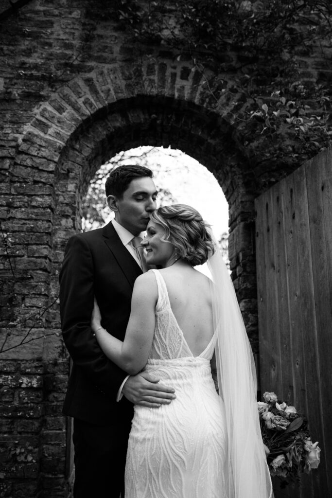 Bride and groom in walled garden at Middleton Lodge