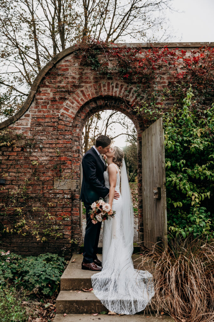 Bride and groom in walled garden at Middleton Lodge