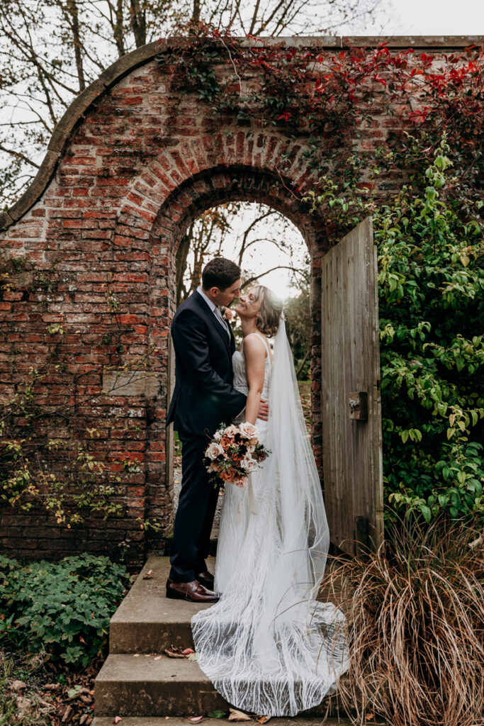 Bride and groom in walled garden at Middleton Lodge