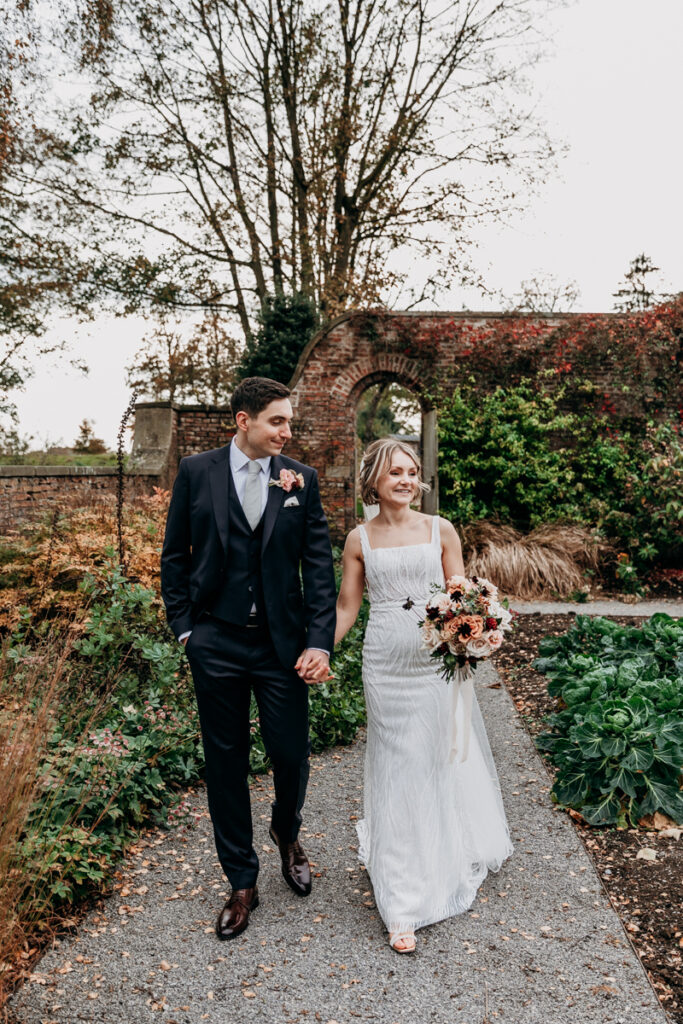 Bride and groom in walled garden at Middleton Lodge