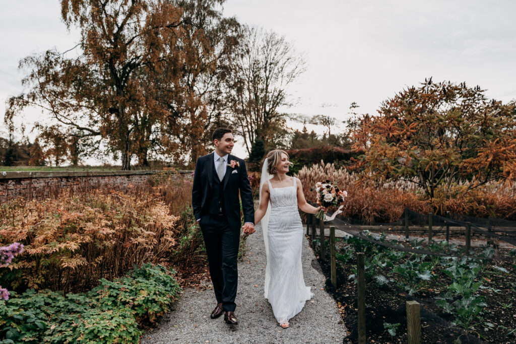 Bride and groom in walled garden at Middleton Lodge