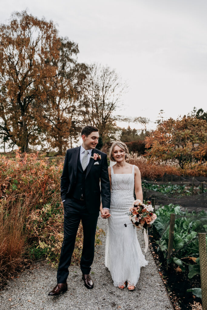 Bride and groom in walled garden at Middleton Lodge