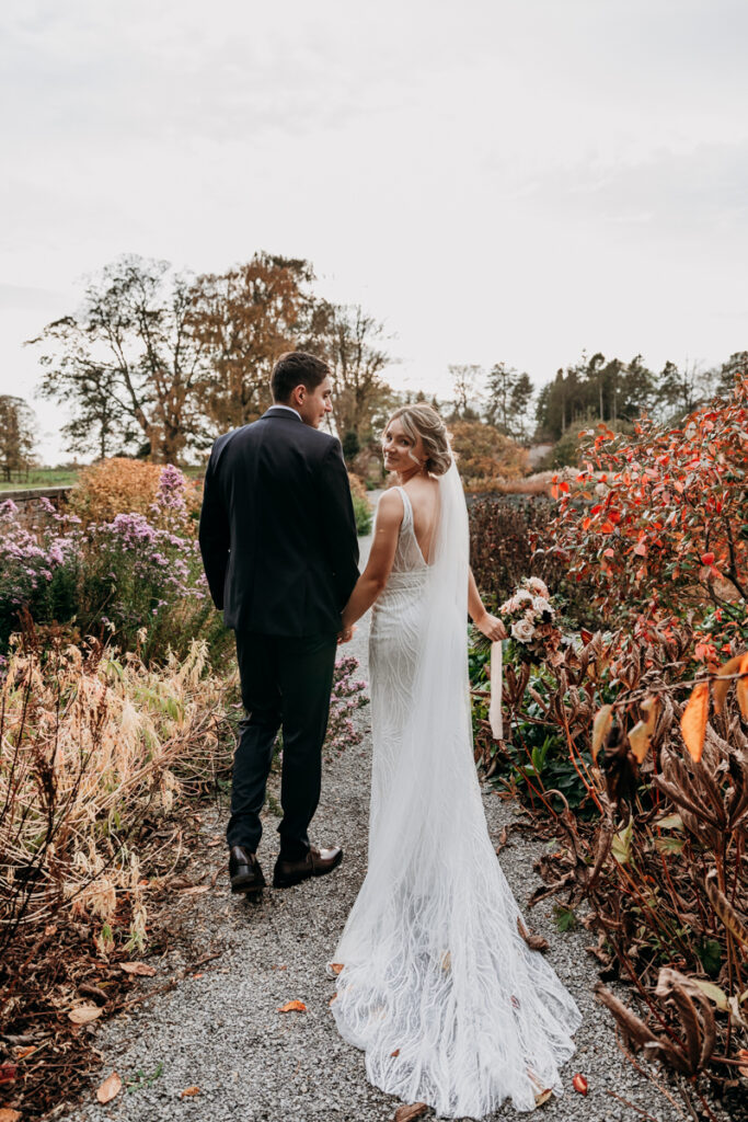 Bride and groom in walled garden at Middleton Lodge